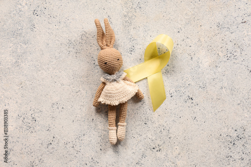 Yellow ribbon with toy bunn...