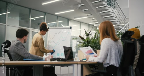 Black businesswoman conducts presentation in modern office