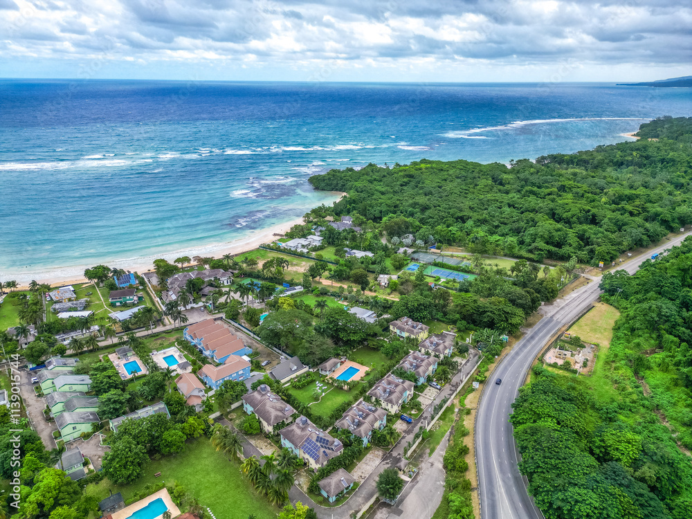 Mammee Bay Ocho Rios St Ann lush north coast aerial view of community and Caribbean sea pristine water crystal clear blue with greenery green trees pool hotels condos in Jamaica Mammee Bay Ocho Rios St Ann lush north coast aerial view of community and Caribbean sea pristine water crystal clear blue with greenery green trees pool hotels condos in Jamaica