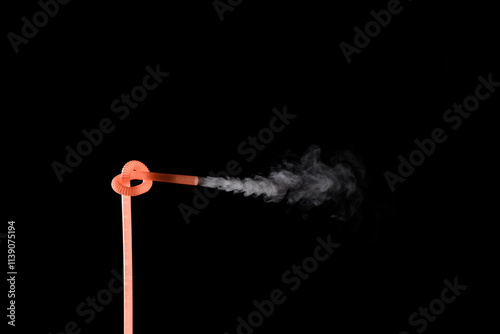 Plastic bio degradable straws with mist shooting from straws creating unique patterns