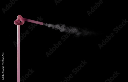 Plastic bio degradable straws with mist shooting from straws creating unique patterns