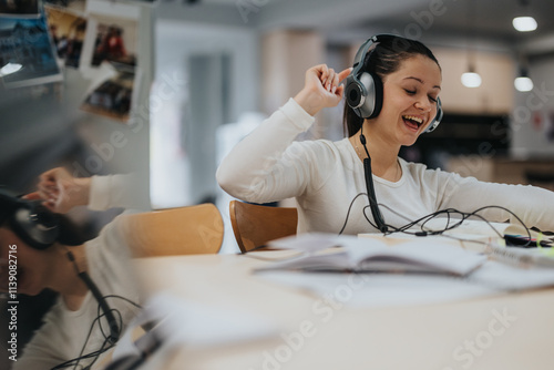Young woman wearing headphones and expressing happiness while listening to music. She is relaxed and absorbed in her own world, creating a joyful and vibrant atmosphere.