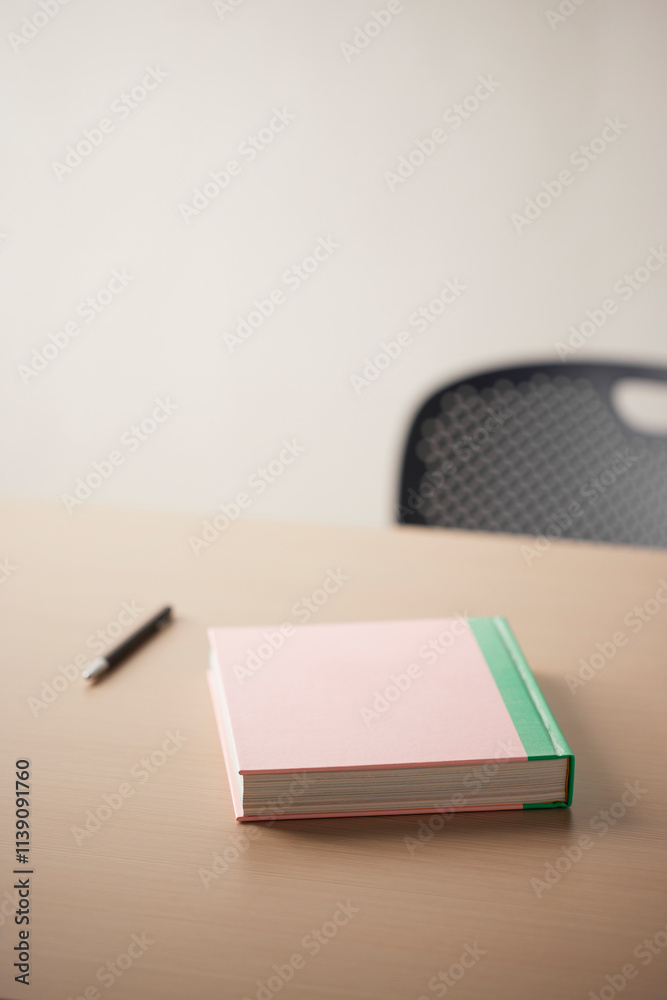 A comfortable workspace. A wooden desk with various objects.