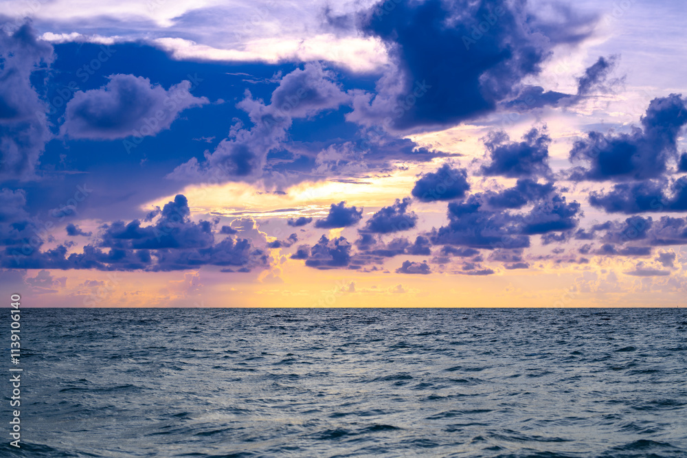 Obraz premium Seascape with dramatic sky and colorful clouds. Sky over sea water landscape. Stormy dramatic sky. Scenic seascape at sea.