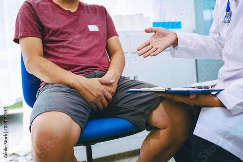 A man suffering from urinary tract infections visits a doctor at the examination table in a hospital.symptoms, discusses benign prostatic hyperplasia (BPH), and provides advice and treatment