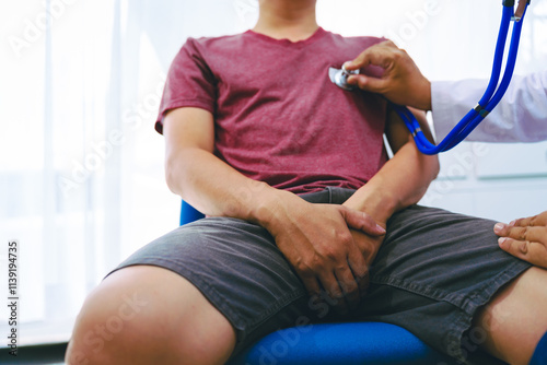 A man suffering from urinary tract infections visits a doctor at the examination table in a hospital.symptoms, discusses benign prostatic hyperplasia (BPH), and provides advice and treatment photo