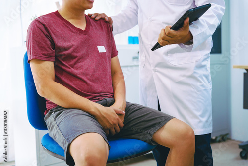 A man suffering from urinary tract infections visits a doctor at the examination table in a hospital.symptoms, discusses benign prostatic hyperplasia (BPH), and provides advice and treatment