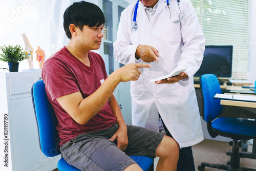 A man suffering from urinary tract infections visits a doctor at the examination table in a hospital.symptoms, discusses benign prostatic hyperplasia (BPH), and provides advice and treatment photo