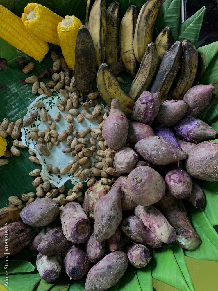 Traditional healthy snacks menu for parties in Indonesia, there are sweet corn, stewed peanuts, potatoes, bananas and breadfruit fresh from steamer. Traditional healthy snacks menu for parties in Indonesia, there are sweet corn, stewed peanuts, potatoes, bananas and breadfruit fresh from steamer.