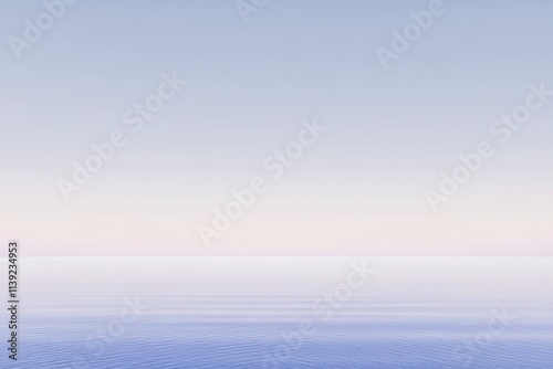 Serene pastel sunrise over calm ocean.