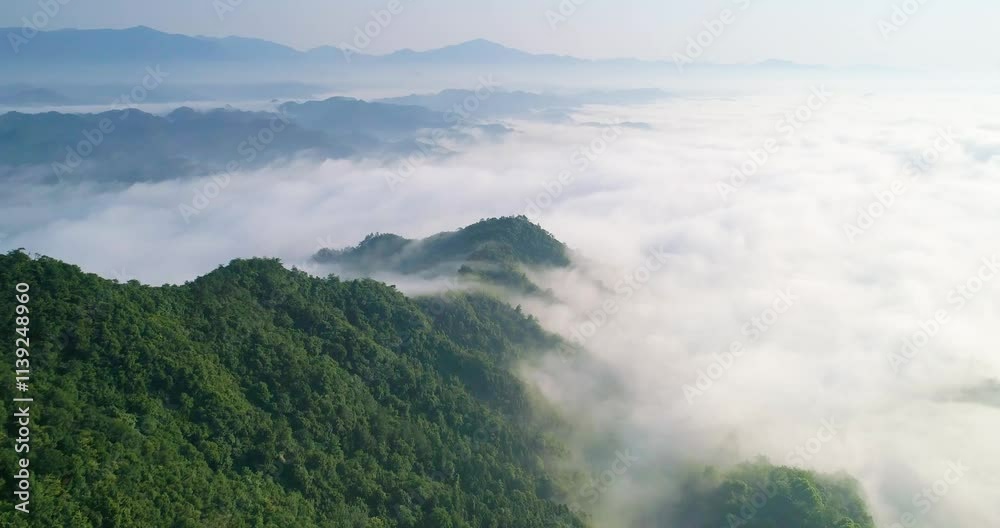 Explore the breathtaking sea of clouds above the hilly mountains in Zhejiang during the early morning light Explore the breathtaking sea of clouds above the hilly mountains in Zhejiang during the early morning light