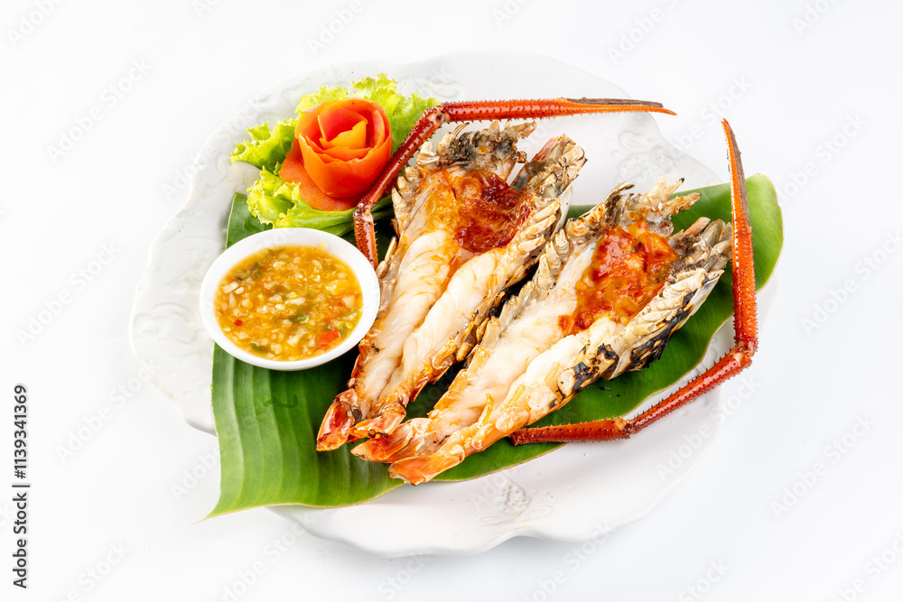 Grilled giant river prawn served on a plate with Thai seafood sauce. On a white background Grilled giant river prawn served on a plate with Thai seafood sauce. On a white background