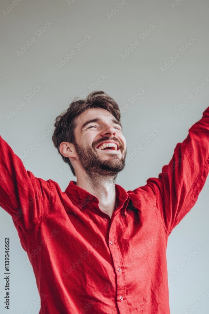 Man Raising Arms in Red Shirt Man Raising Arms in Red Shirt