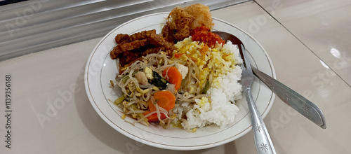 Lunch of vegetables and tempeh with chili sauce