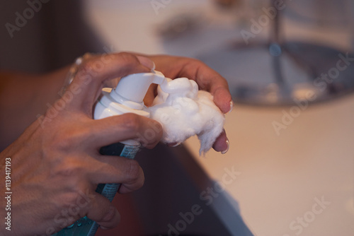 person washing hands cream make up