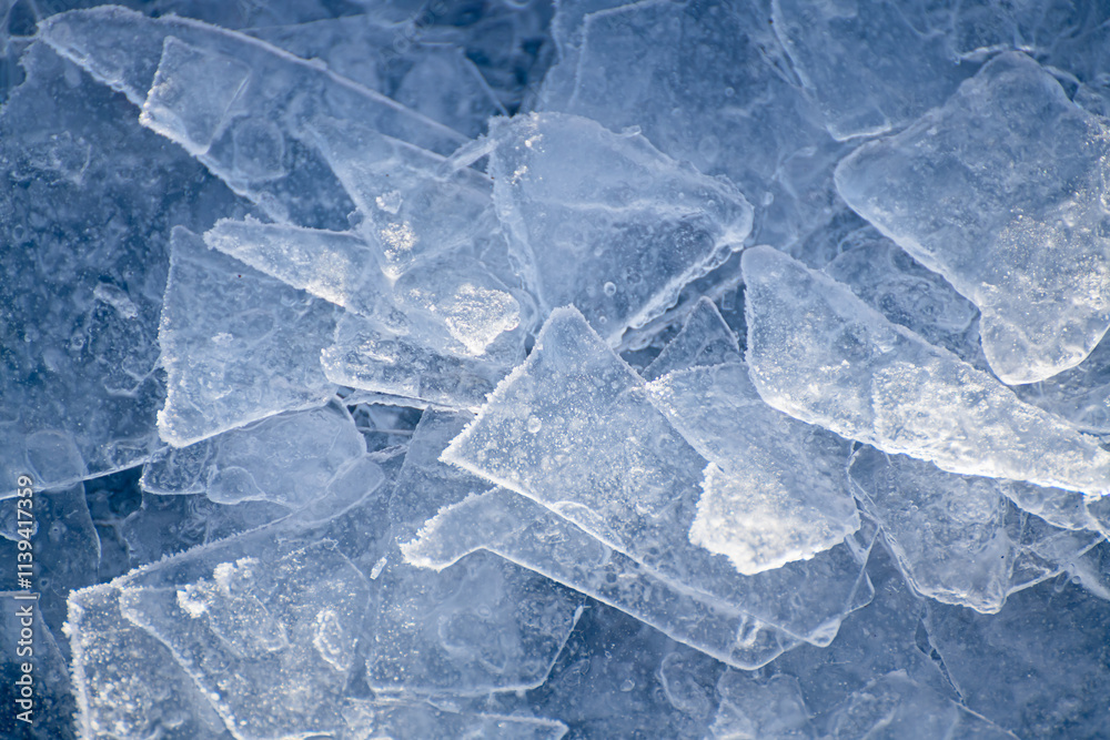 Ice floes with hoarfrost on the frozen lake.