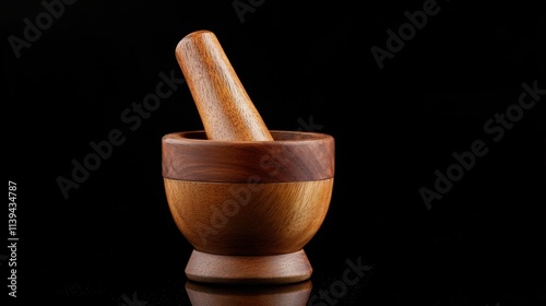 A traditional wooden mortar and pestle on a black background, highlighting the rounded edges and organic shape of the tools.