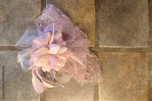 pink feather and mesh fascinator