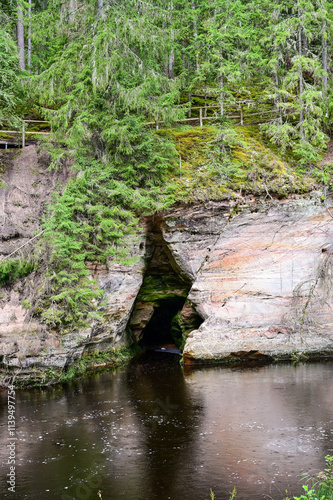 Sandstone cliffs and mystical caves along the Ahja River on the Taevaskoda hiking trail in summer near Põlva, Saesaare-Taevaskoja, Estonia	
 photo