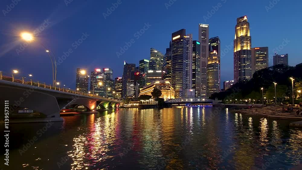 Beautiful night scene of Singapore's downtown. 4K resolution time-lapse of the Singapore skyline at night. Beautiful night scene of Singapore's downtown. 4K resolution time-lapse of the Singapore skyline at night.