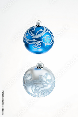 levitation of blue and silver Christmas ornament on a white isolated background