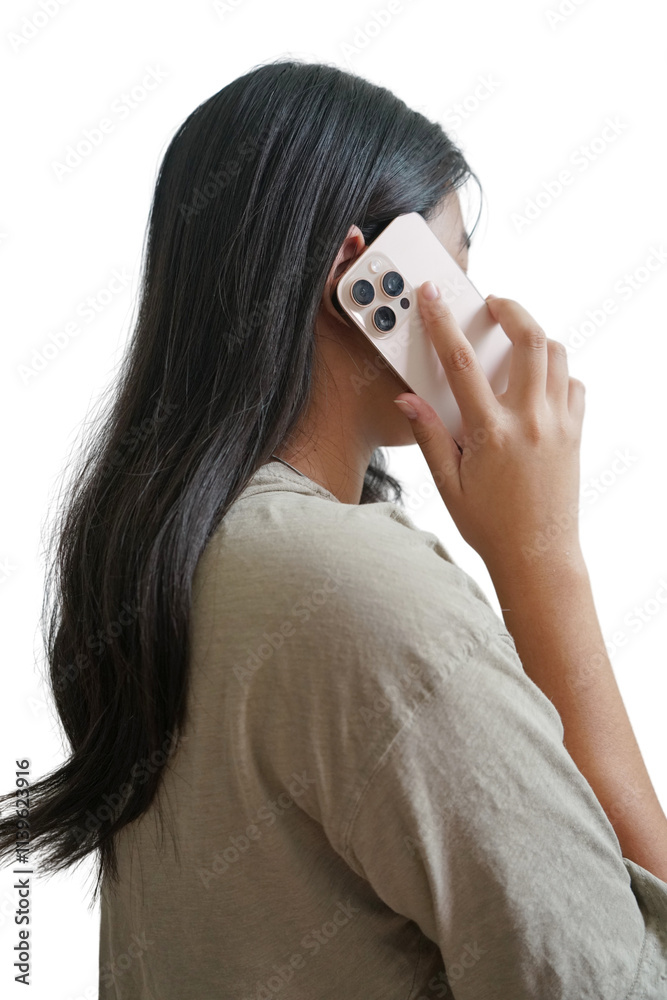 A woman is talking on her cell phone A woman is talking on her cell phone