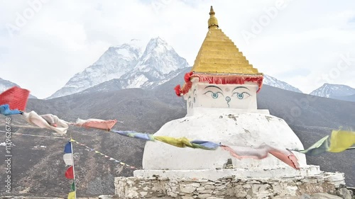 Footage of an ancient Tibetan Buddhist stupa with beautiful view of Mt.Ama Dablam seen from Dingboche village Nepal.