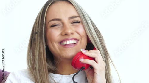 Happy Young Woman Talking Over Landline Telephone, Close Up photo