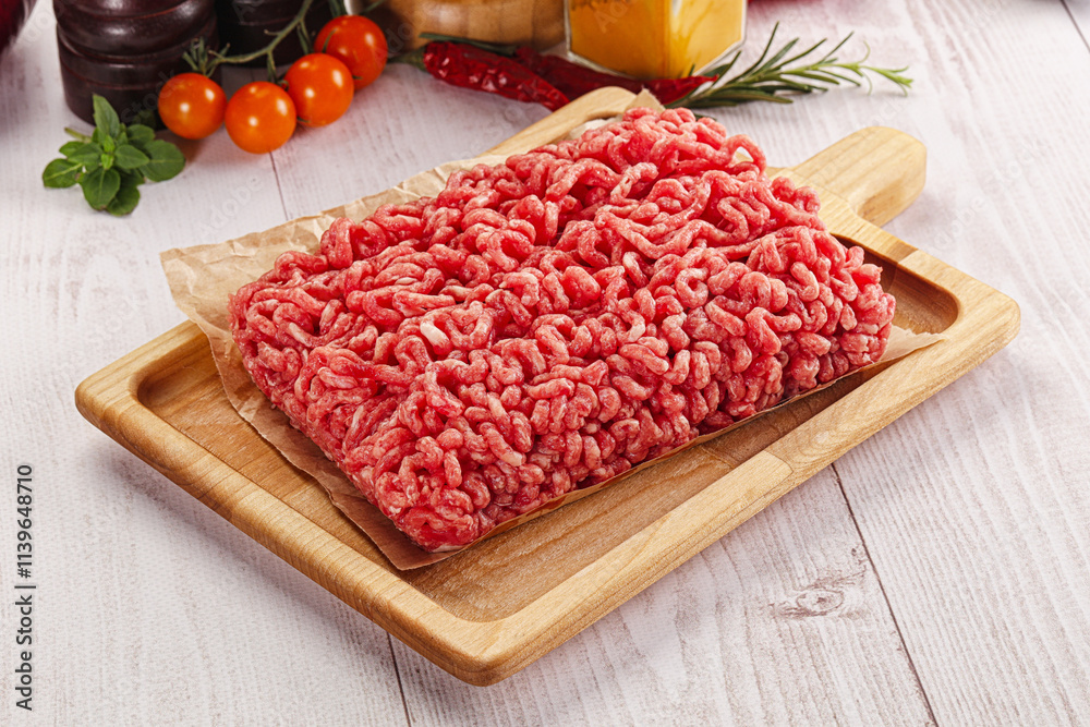 Raw minced beef meat over board Raw minced beef meat over board