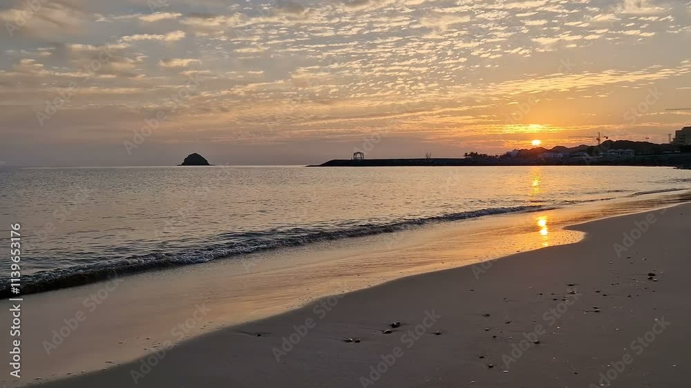 Sandy beach and ocean surf at sunset. Sandy beach and ocean surf at sunset.