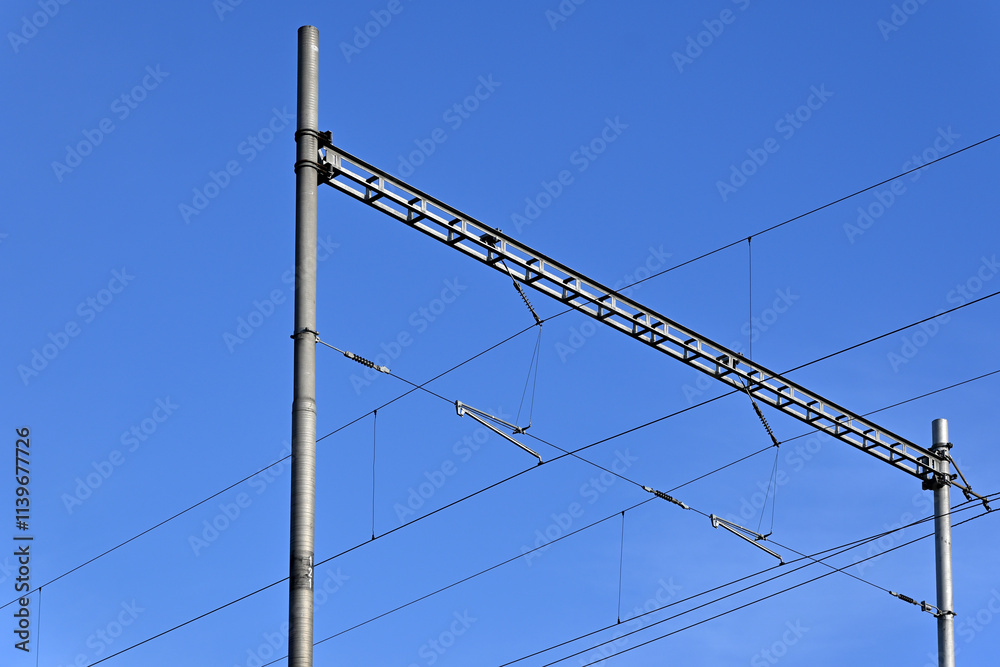Traction line poles at the railway line Traction line poles at the railway line