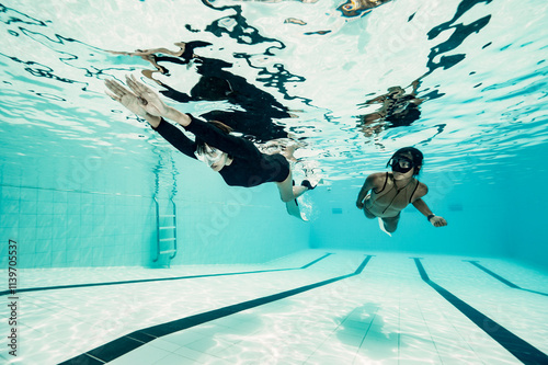 freediver instructor supervising student in a pool in Bangkok