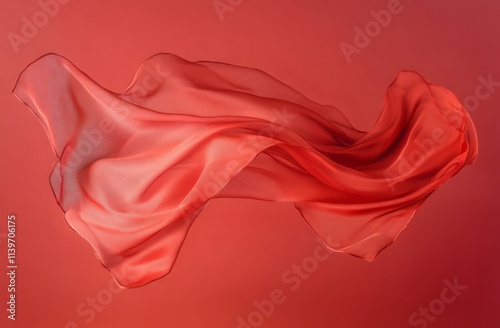 Red fabric flows in elegant...
