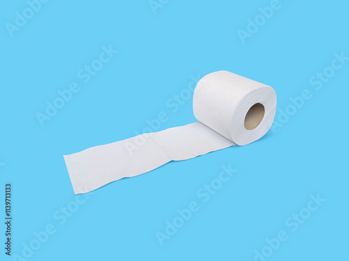 Toilet paper roll on blue background photo