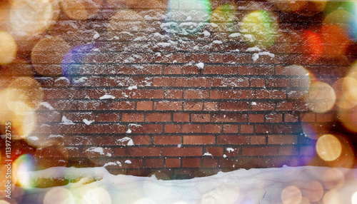 冬・雪の積もった古いビンテージの煉瓦の積み重なった壁　季節の背景壁紙　雪に覆われた街の風景　キラキラ輝くイルミネーションのボケの光　　新年・クリスマス・正月・年末・の背景素材 photo