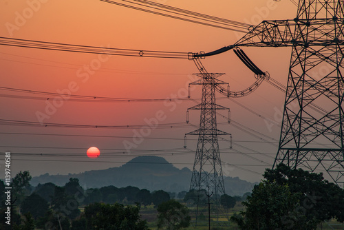 high-voltage power lines at sunset, high voltage electric transmission tower