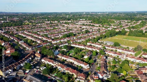 Aerial drone footage of the town of Beckenham which is in Greater London in the UK showing British houses and row of homes in the housing estates from above on a sunny day in the summer time photo