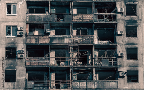 destroyed and burned houses in the city in Ukraine photo