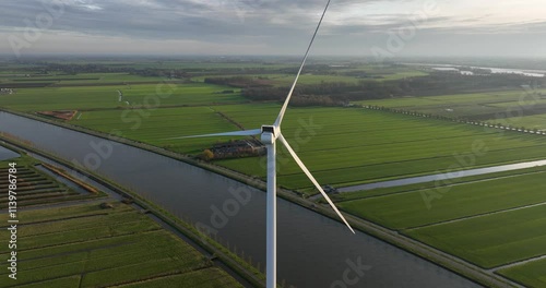 An aerial drone video of Dutch wind turbines, Holland polder landscape. Green energy. photo