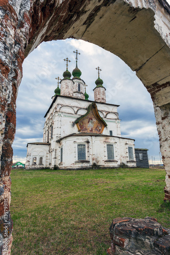 Framed by an arch church of Demetrius of Thessalonica (Dmitry Solunsky) in Dymkovskaya Sloboda, Veliky Ustyug, Vologda region, Russia
