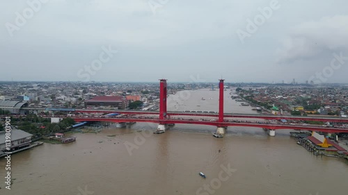 Aerial view of Palembang's Ampera bridge over the Musi river photo