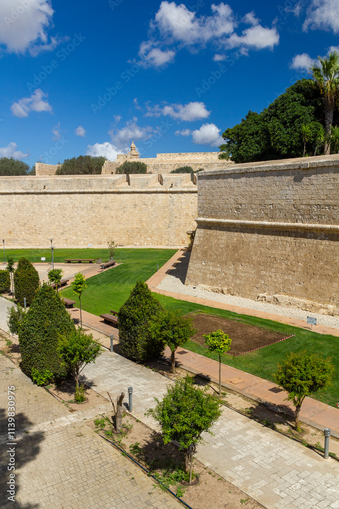 the park in front of the city walls of Mdina, Malta the park in front of the city walls of Mdina, Malta