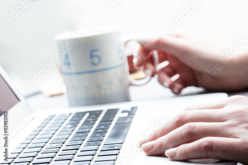 Businesswoman taking a coffee break at work photo