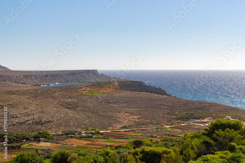 coastline view of the Ras in-Niexfa Bay in Malta at a clear blue sky summer day photo