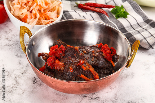 Baked beef cheeks with vegetables