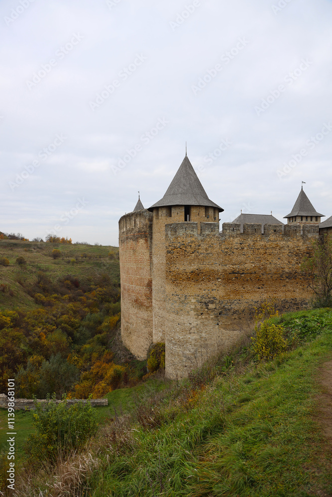 Khotyn fortess, castle in Ukraine in autumn. One of seven wonders of Ukraine. Exterior view of Khotyn Fortress, fortification complex on Dniester bank in Khotyn town, outdoors Khotyn fortess, castle in Ukraine in autumn. One of seven wonders of Ukraine. Exterior view of Khotyn Fortress, fortification complex on Dniester bank in Khotyn town, outdoors