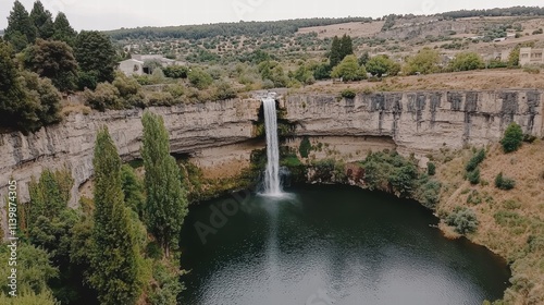 Serene Waterfall Cascading into a Tranquil Green Oasis