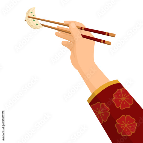 Female hand holding a dumpling using chopsticks