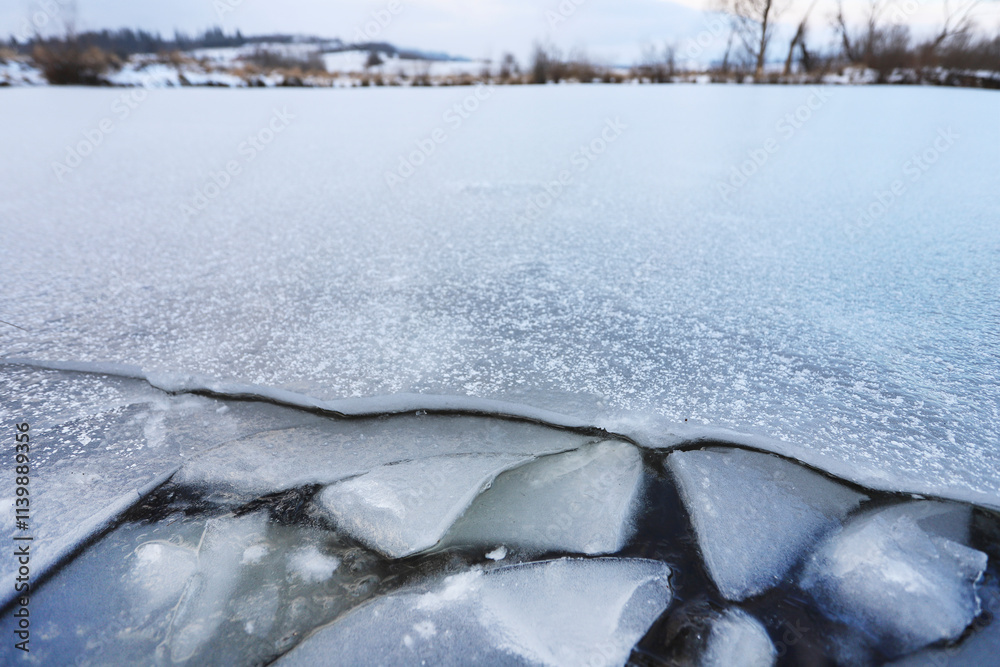 A cracked sheet of ice on the lake. A cracked sheet of ice on the lake.