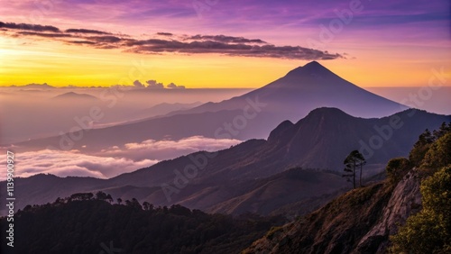 Warm sunset light illuminating mountain ridges and valleys blanketed in clouds, with a majestic volcano rising in the background, creates a breathtaking panorama of the guatemalan highlands photo